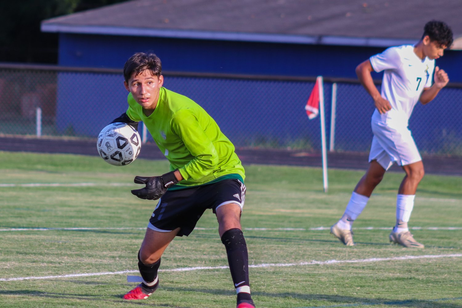 Jordan-Matthews goalkeeper Ricardo Rocha (with ball) prepares to roll the ball to his teammate after making a save in the Jets' 4-1 season-opening win over the Chargers last Thursday in Siler City.